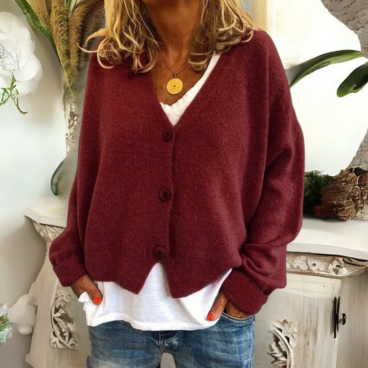 Kincső | Elvágott V-nyakú kardigán elegáns hasfedéssel