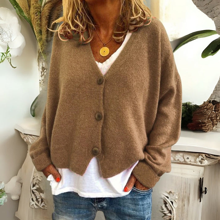 Kincső | Elvágott V-nyakú kardigán elegáns hasfedéssel