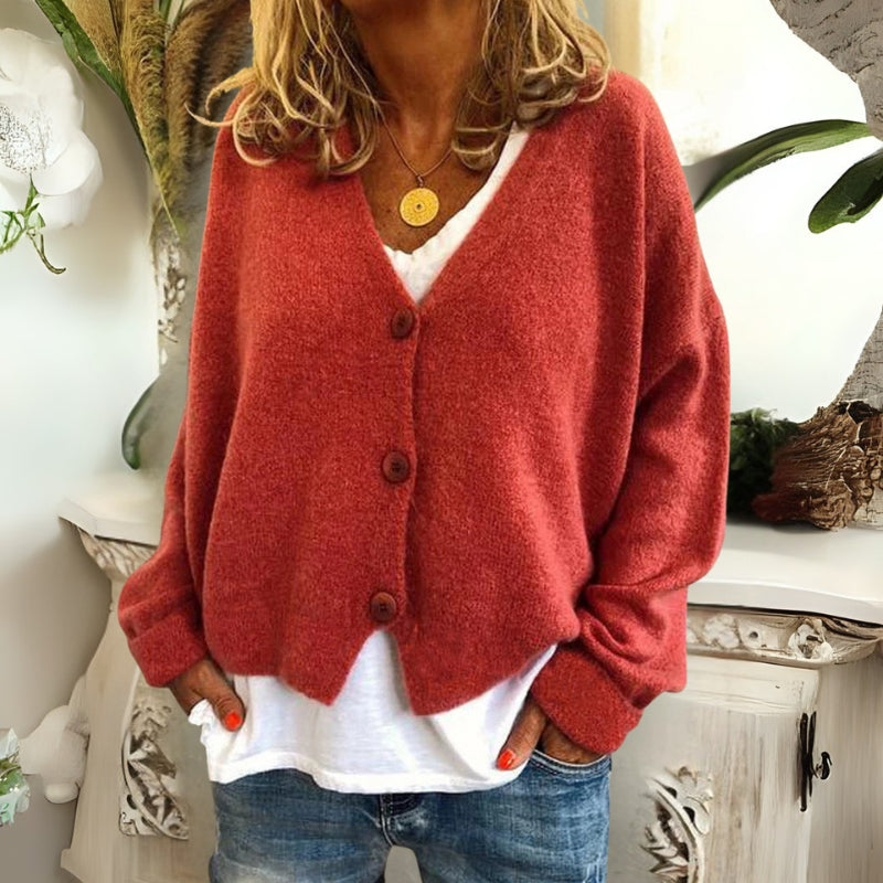 Kincső | Elvágott V-nyakú kardigán elegáns hasfedéssel