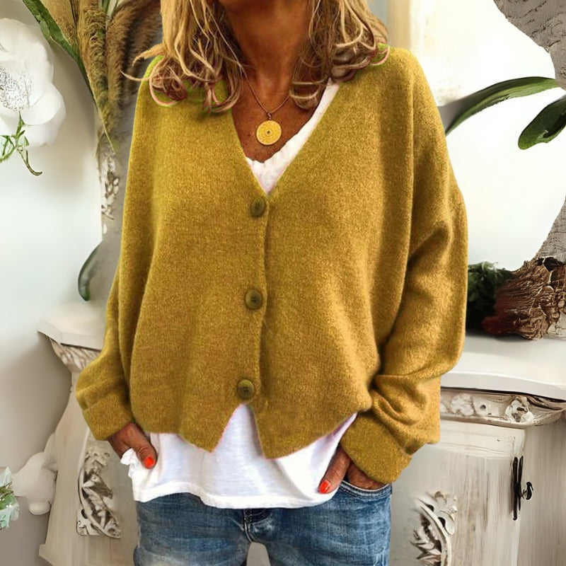 Kincső | Elvágott V-nyakú kardigán elegáns hasfedéssel