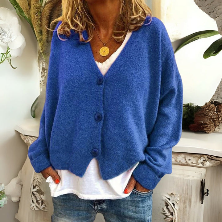 Kincső | Elvágott V-nyakú kardigán elegáns hasfedéssel