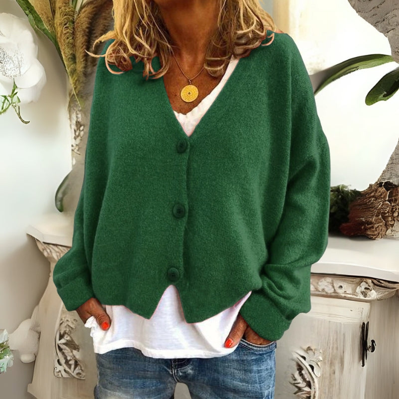 Kincső | Elvágott V-nyakú kardigán elegáns hasfedéssel