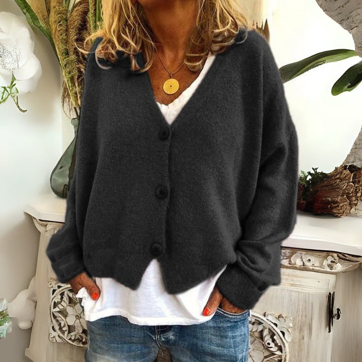 Kincső | Elvágott V-nyakú kardigán elegáns hasfedéssel