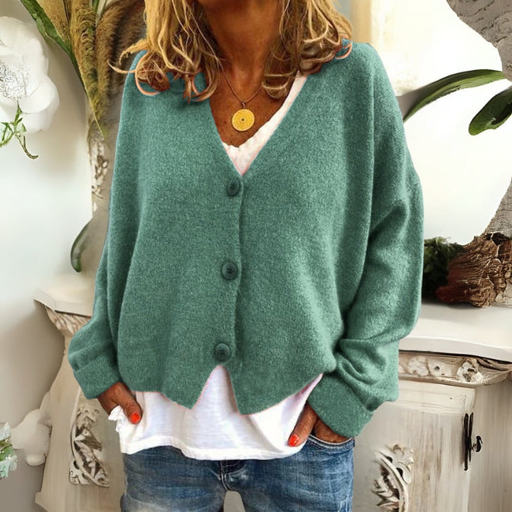 Kincső | Elvágott V-nyakú kardigán elegáns hasfedéssel