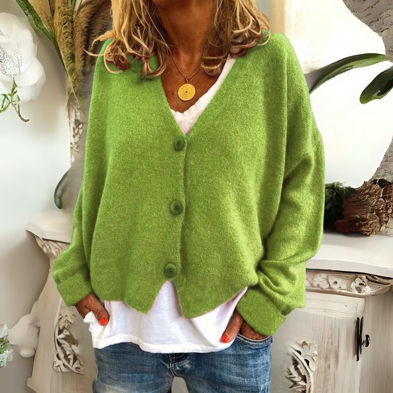 Kincső | Elvágott V-nyakú kardigán elegáns hasfedéssel