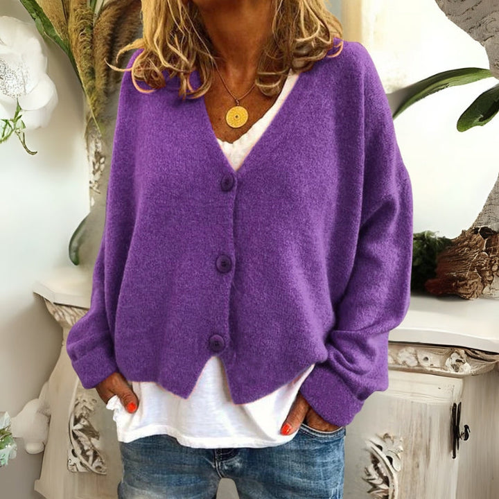 Kincső | Elvágott V-nyakú kardigán elegáns hasfedéssel